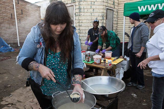 Melinda, a volunteer from Williamsburg, distributes soup